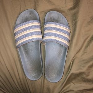 light blue Adidas flip flops